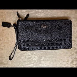 Black leather Coach wristlet.